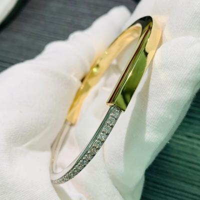 Tiffany Lock Bangle in Yellow and White Gold with Half Pavé Diamonds